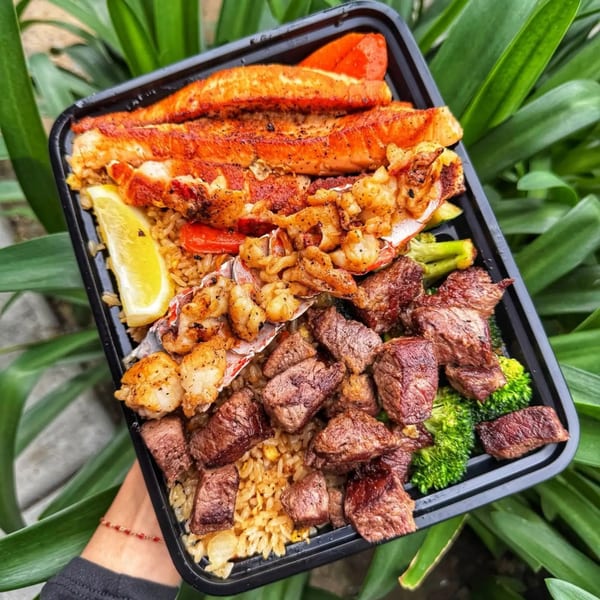 Habachihana Grill's steak, shrimp, lobster, and salmon meal with rice, broccoli, and lemon.